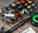 A flat lay of essential fishing gear including a reel, rod, lures, and a checklist.