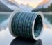 Close-up of JOSBY 8-strand speckled camouflage braided fishing line on a spool.